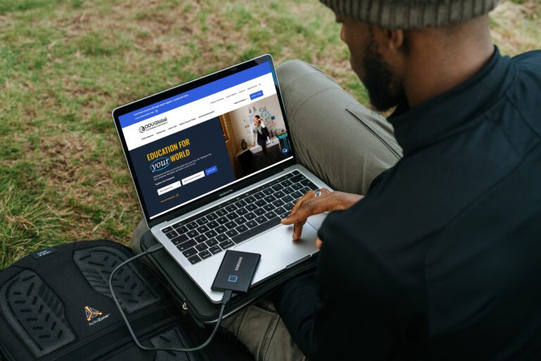 Man using odu global site on laptop