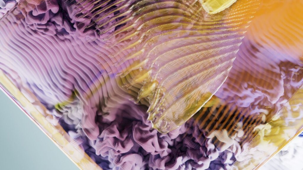 Abstract render of rippling purple and gold layers seen through a glass surface