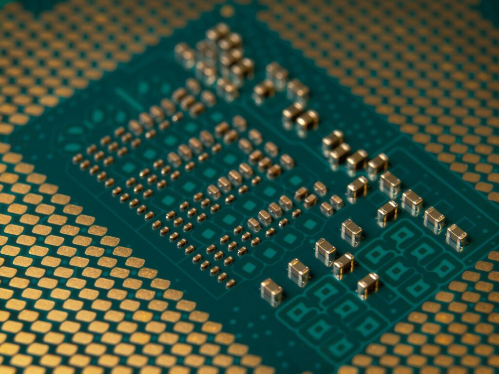 Macro view of a processor's green circuit board with tiny gold contacts and components